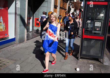 Woman on her hen party wearing a Union Jack flag as a dress, central London, UK. A bachelorette party, hen party, hen night or hen do, is a party held for a woman who is about to get married. The terms hen party, hen do or hen night are common in the United Kingdom. Stock Photo