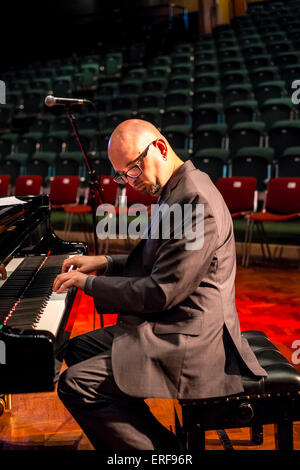 Ethan Iverson playing piano during sound check with The Bad Plus at the Turner Sims in Southampton, England Stock Photo