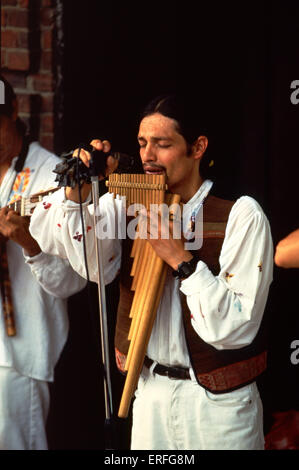 South America  musician playing PAN PIPES, (Andean Pipes) Microphone Stock Photo