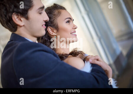 Portrait of happy wedding couple in classic interior Stock Photo