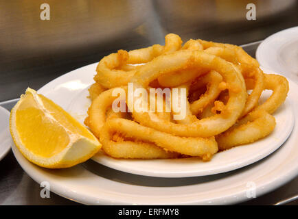 Plate of calamari with lemon Stock Photo