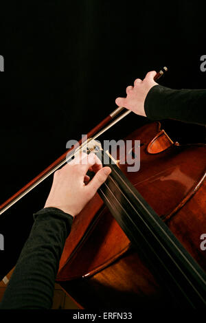 Cello - woman in playing position, cellist. Stock Photo