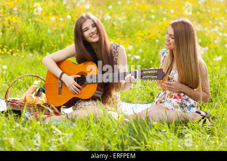 Two beautiful young women on a picnic Stock Photo