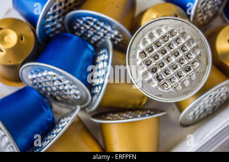 Spent or used empty Nespresso capsules, coffee capsules, aluminium capsules, raw material recycling Stock Photo