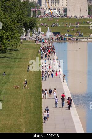 WASHINGTON, DC, USA - People walk along reflecting pool on National Mall. Stock Photo
