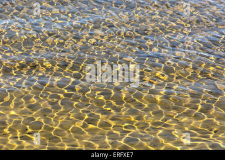 Bright, colorful reflections on the water. Soft focus. Stock Photo