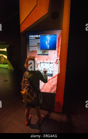 Family Fun in Montreal, Quebec, Canada. Biosphere Museum. Girl using interactive screen. Stock Photo