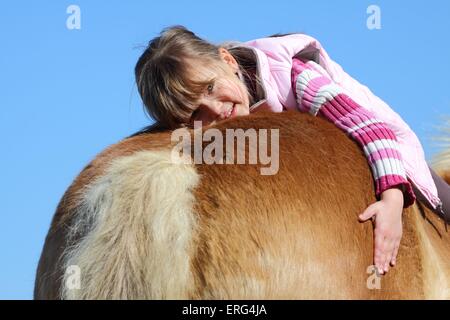 girl with Haflinger horse Stock Photo