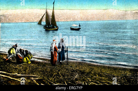 The Dead Sea.  Postcard from early 1900s with single boat. Published by Cairo postcard trust. Stock Photo