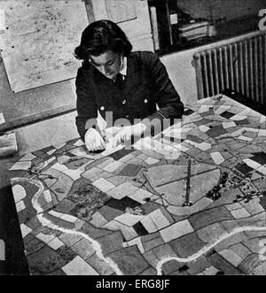 World War 2 - the Women's Auxiliary Air Force, working on a pictorial map  at a Bomber Station.  Published 1941 Stock Photo