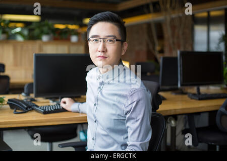 IT worker sitting in office Stock Photo