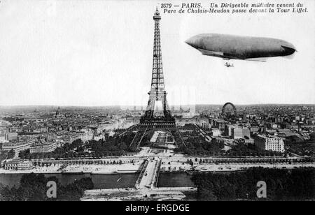 Military airship flying near Eiffel Tower, Paris. On route from Parc de Chalais- Meudon. C. 1900. View of Paris from airship. Stock Photo