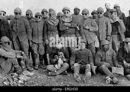 French soldiers with dog wearing gas masks during gas mask parade in trench, Western Front, World War 1. 1916. Stock Photo