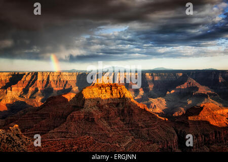 Evening spring shower creates rainbow over the North Rim of Arizona’s Grand Canyon National Park from Cape Royal. Stock Photo