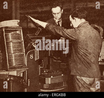 Machine pressing 'His Master's Voice' gramophone records, c.1920. Stock Photo