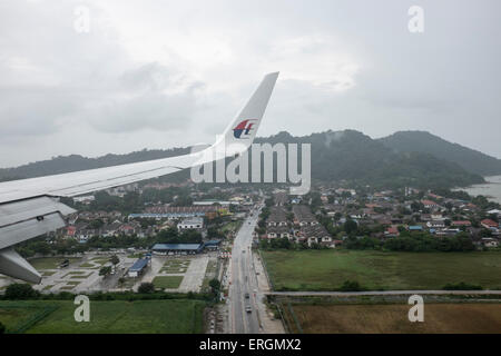 The Malaysia Airlines logo is seen on the winglet of a Malaysia Aircraft in flight over Malaysia, May 31, 2015.