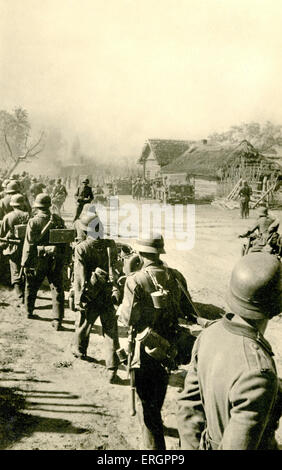 Soviet (Russian) soldiers marching through a muddy field near Odessa ...