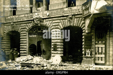 German (November) Revolution in Berlin, Germany, 1918. Street fighting - rubble and damaged shops. In November 1918 Spartacist leader Karl Liebknecht declared the German Socialist Republic. In the following months, this led to a General Strike and Spartacist uprising. Liebknecht was murdered in the repression of the uprising. KL: German socialist and a co-founder with Rosa Luxemburg of the Spartacist League and the Communist Party of Germany, 13 August 1871 - 15 January 1919. Stock Photo