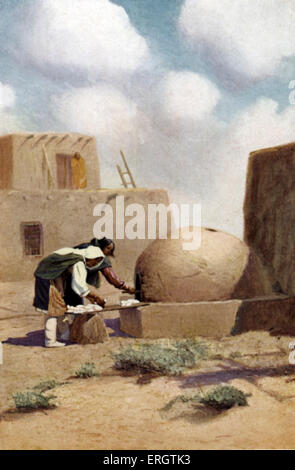 Native American women from the Acoma Pueblo, New Mexico, baking bread in a traditional dome - shaped clay oven. Pueblo Indian. Stock Photo