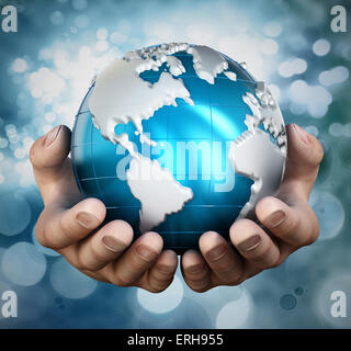 Blue globe in cupped hands. Stock Photo