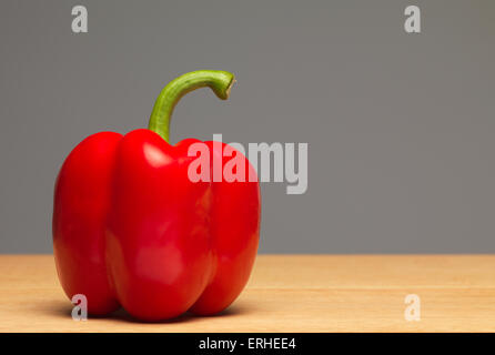 Red Pepper on chopping board Stock Photo