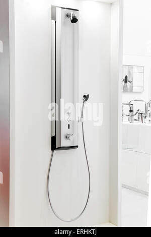 Modern chrome metal shower fixed on the wall Stock Photo