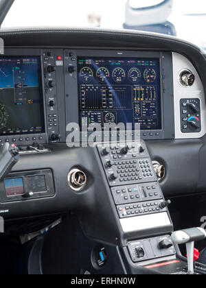 the high-tech 'all glass' cockpit of a Cirrus 22T/GTS two seater leisure aircraft,at Aerexpo 2015 aviation event,at Sywell airfi Stock Photo