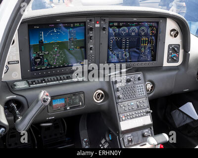 the high-tech 'all glass' cockpit of a Cirrus 22T/GTS two seater leisure aircraft,at Aerexpo 2015 aviation event,at Sywell airfi Stock Photo