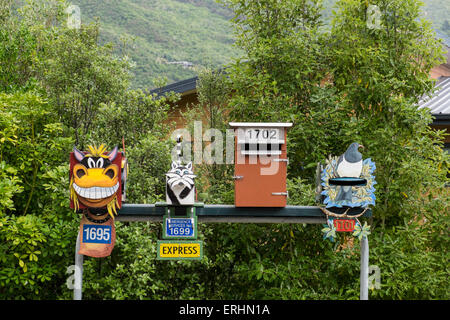 Novelty mailboxes on a roadside in New Zealand. Stock Photo