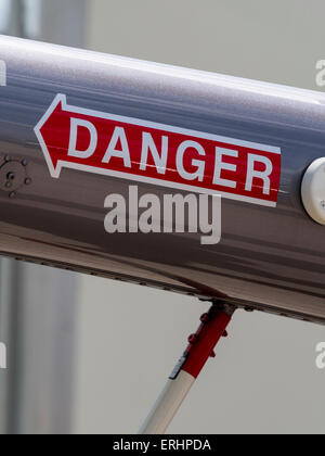 'Danger' warning sign near the tail rotor of a Robinson leisure ...