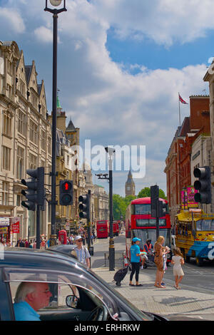 A mixture of London icons: Big Ben, A red London bus, a black taxi cab. Stock Photo
