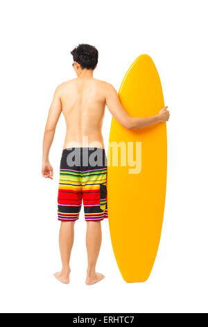 rear view  young man holding surfboard Stock Photo