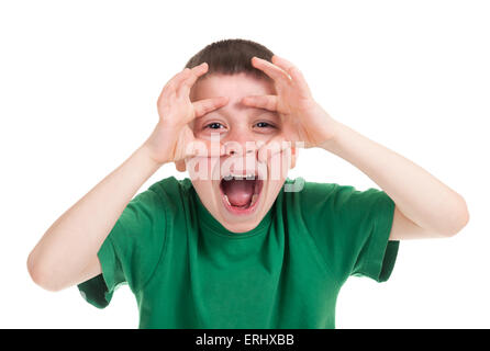 boy looks through his hands like binoculars Stock Photo