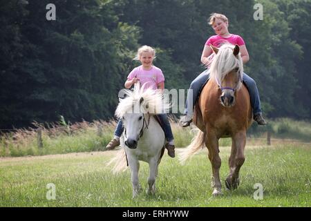 girl and ponys Stock Photo