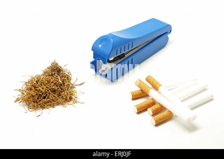 cigarette making machine with cigarette tube and tobacco leaves isolated on white background Stock Photo