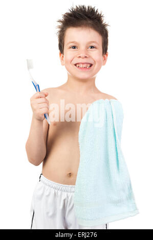 child with wet hair brushing teeth Stock Photo