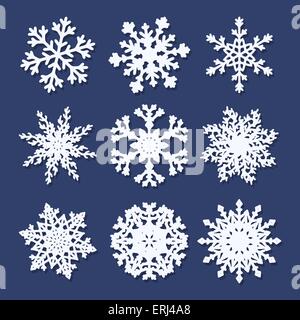 Set of  white paper snowflakes isolated on blue background. Vector illustration. Stock Vector