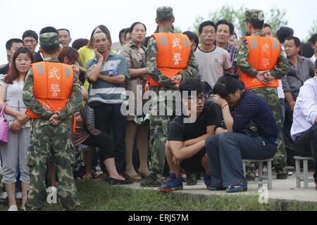 Jianli, China. 03rd June, 2015. Relatives of the travellers in the sank ship 'Eastern Star' on the bank of the Yangtze River are waiting for the new message for recurring in Jianli county, Hubei province, central China, 3th June 2015. The ship, Carrying 406 passengers, five travel agency workers and 47 crew members, sank at around 9:28 p.m. (1328 GMT) on Monday,  according to the Xinhua News Agency Said. Credit:  Panda Eye/Alamy Live News Stock Photo