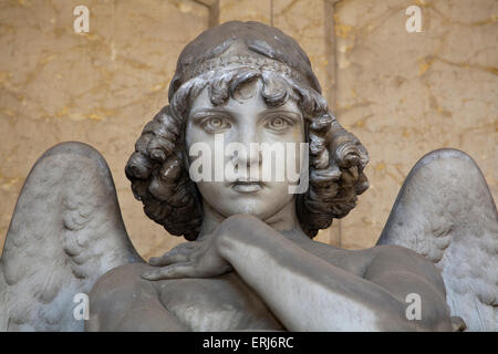 portrait of loving angel on marble, in monumental cemetery of Genoa, more than 100 years old statue Stock Photo