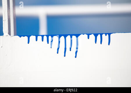 Blue paint drips abstract on white Stock Photo