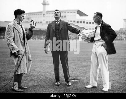 England tour of Australia for the Ashes 1928 - 29. Day two of the Second Test at Sydney Cricket Ground. During the interval when bad light stopped play on Saturday, Mr Alfred Noble presents a boomerang to Jack Hobbs for his 46th birthday. 15th December 1928. Stock Photo