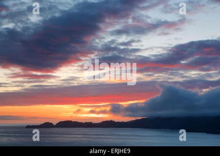 Amazing sunset over the Marin Headlands at the Golden Gate Bridge Stock Photo