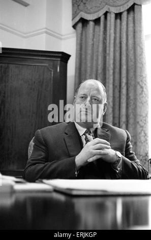 Dr Richard Beeching, Chairman of British Railways, pictured in his office, 15th March 1961. He became a household name in Britain in the early 1960s for his report 'The Reshaping of British Railways', commonly referred to as 'The Beeching Report', which led to far- reaching changes in the railway network, popularly known as the Beeching Axe. Source Wikipedia. Stock Photo