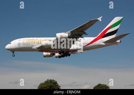 Emirates Airbus A380 long haul airliner on approach to London Heathrow. Side view. Stock Photo