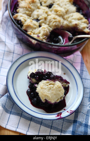 Freshly made fruit cobbler with a portion on a dish Stock Photo