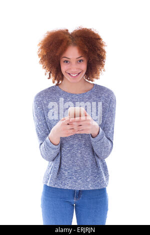 African American young woman sending a text message on her smartphone - Black teenager people Stock Photo