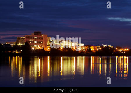 Waikato Hospital reflected in Lake Rotoroa at dawn, Hamilton, Waikato, North Island, New Zealand Stock Photo