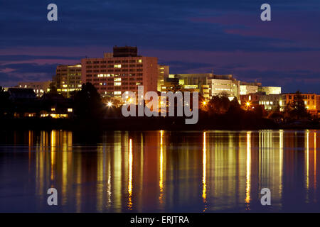 Waikato Hospital reflected in Lake Rotoroa at dawn, Hamilton, Waikato, North Island, New Zealand Stock Photo