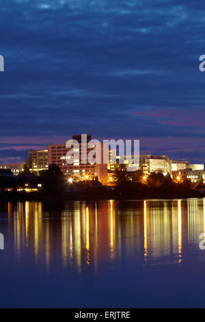 Waikato Hospital reflected in Lake Rotoroa at dawn, Hamilton, Waikato, North Island, New Zealand Stock Photo