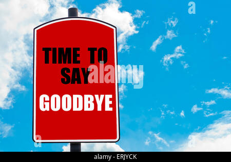 Time To Say Goodbye motivational quote written on red road sign isolated over clear blue sky background. Concept image with available copy space Stock Photo